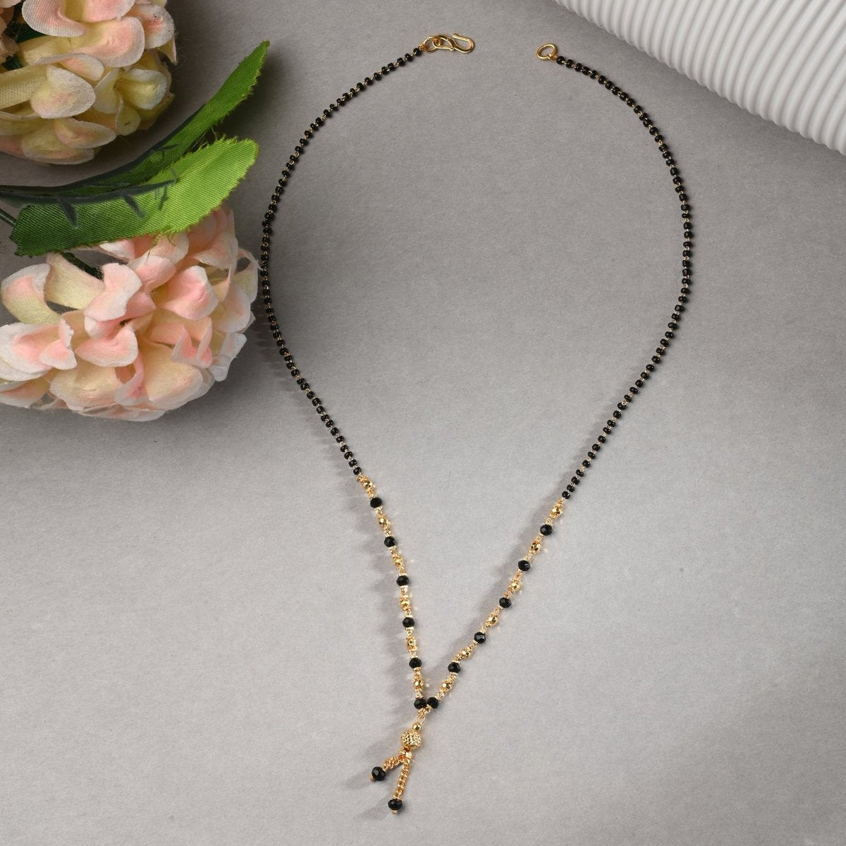 AanyaCentric Gold-Polished Jewelry Combo: Elegant Short Mangalsutra, Finger Ring, and American Diamond Earrings Set