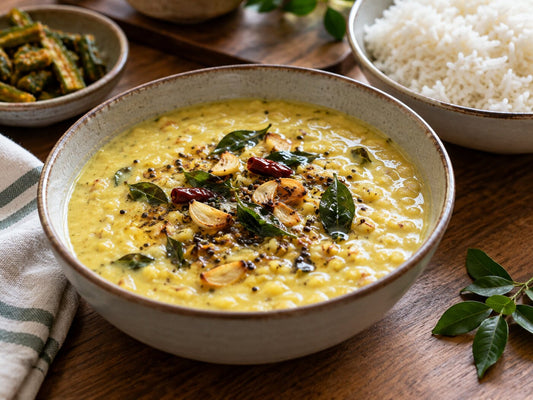 Coconut moong dal with a garlic and curry leaf tempering beside rice