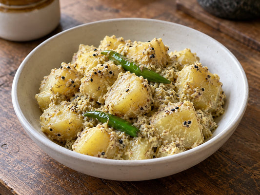Aloo posto with poppy seed paste and green chillies, generated illustration