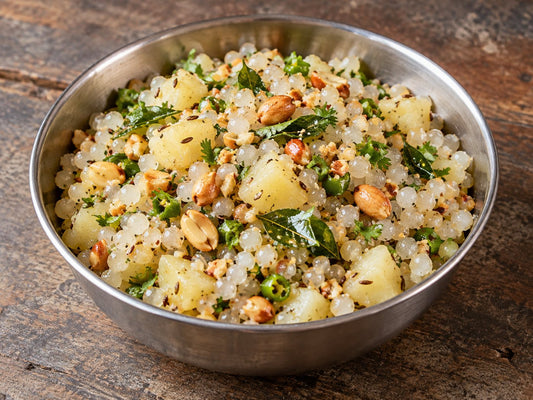 Translucent small tapioca pearls mixed with coarse toasted peanuts and boiled potato cubes, cumin seeds, green chilli, curry leaves, chopped coriander, generated illustration