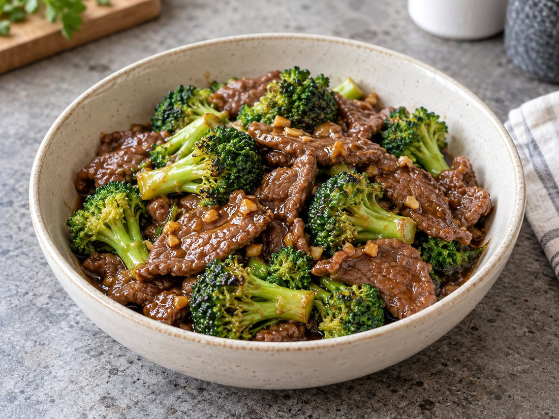 Illustrative sliced beef and broccoli in soy sauce with sesame seeds.