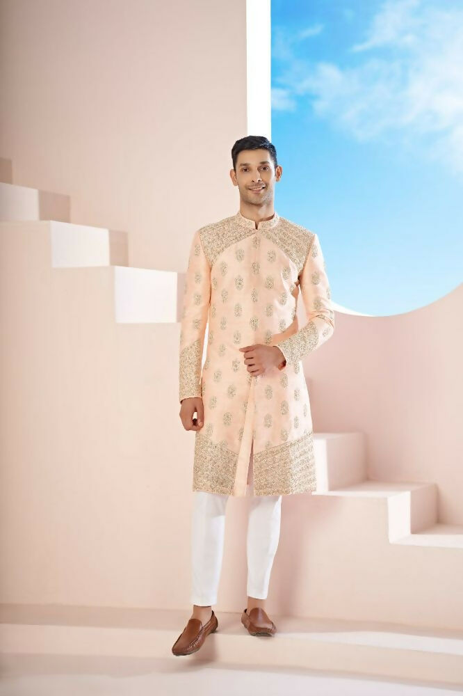 The Peach Sherwani Features Hexagonal Butas , V-Shaped Floral Jal Borders by Hilo Design