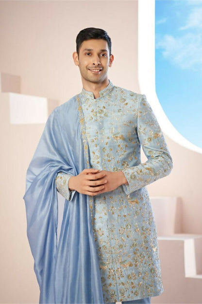 Majestic Blue Sherwani With Intricate Gold Crane And Floral Hand Embroidery. by Hilo Design