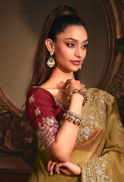 Monjolika Fashion Designer Golden Tissue Organza Saree With All Over Butta Work & Heavy Stone Embellished Border