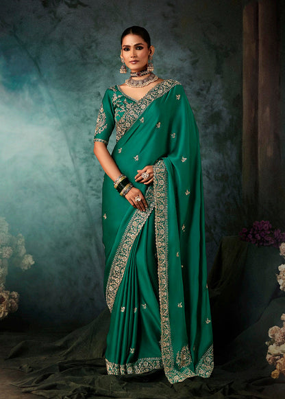 Monjolika Fashion Teal Green Faux Satin Embroidery Bridal Reception Festival Wedding Wear Heavy Border Saree