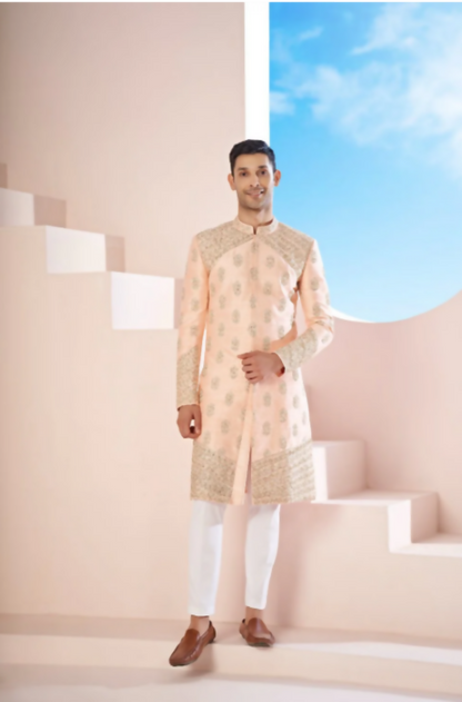 The Peach Sherwani Features Hexagonal Butas , V-Shaped Floral Jal Borders by Hilo Design