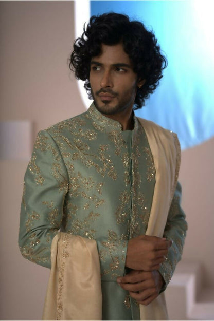 Majestic Mint Green Dupion Silk Sherwani With Satin Dhoti & Santone Dupatta by Hilo Design