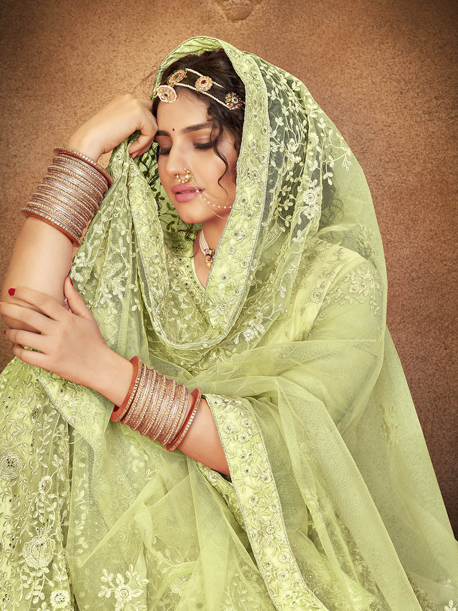Myra Pista Green Heavy Embroidered Net Lehenga
