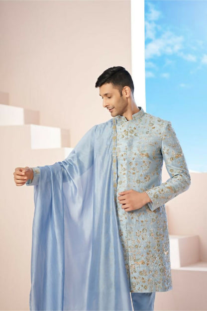 Majestic Blue Sherwani With Intricate Gold Crane And Floral Hand Embroidery. by Hilo Design