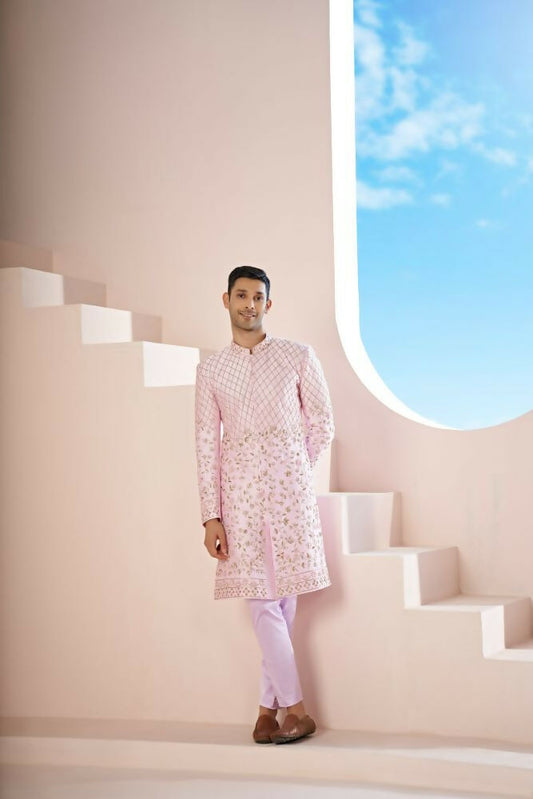 A Pink Sherwani Featuring Elegant Cross-Line Patterns Adorned With Intricate Floral Designs by Hilo Design