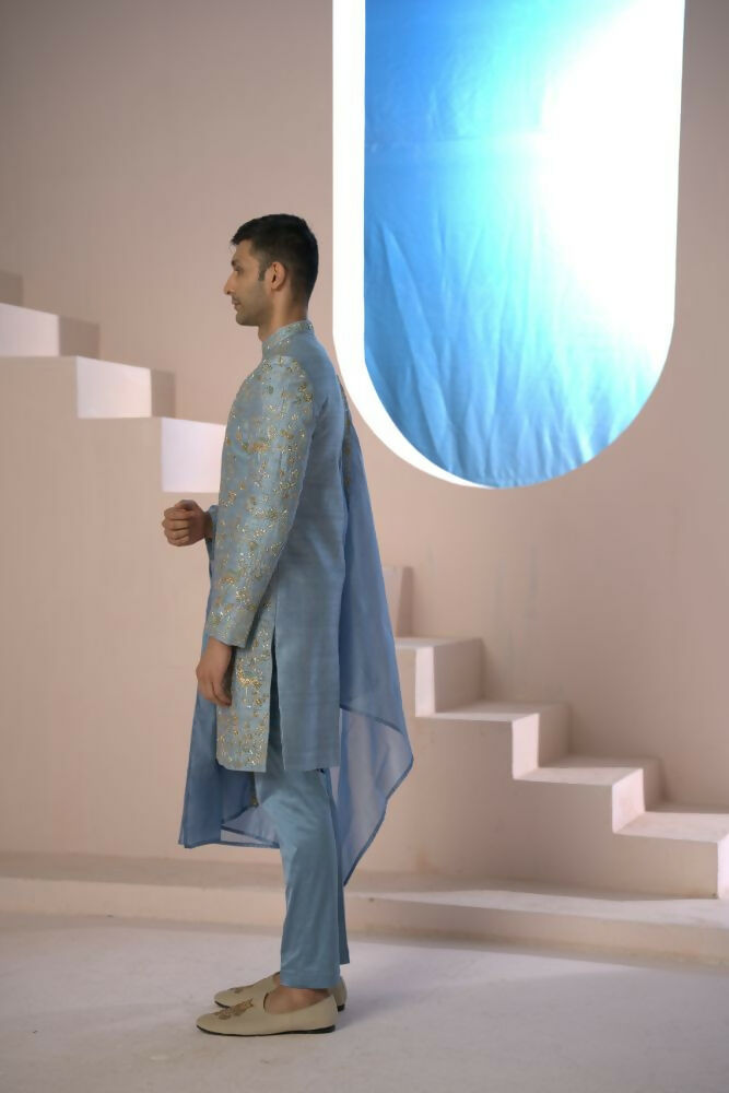 Majestic Blue Sherwani With Intricate Gold Crane And Floral Hand Embroidery. by Hilo Design