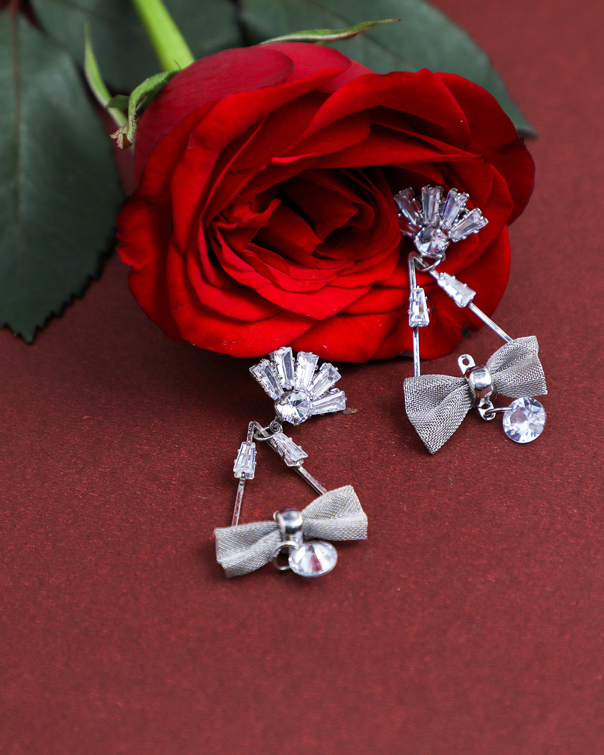 VOJ Silver Plated Stone Studded With Bow Triangle Shaped Earrings