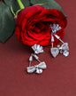 VOJ Silver Plated Stone Studded With Bow Triangle Shaped Earrings