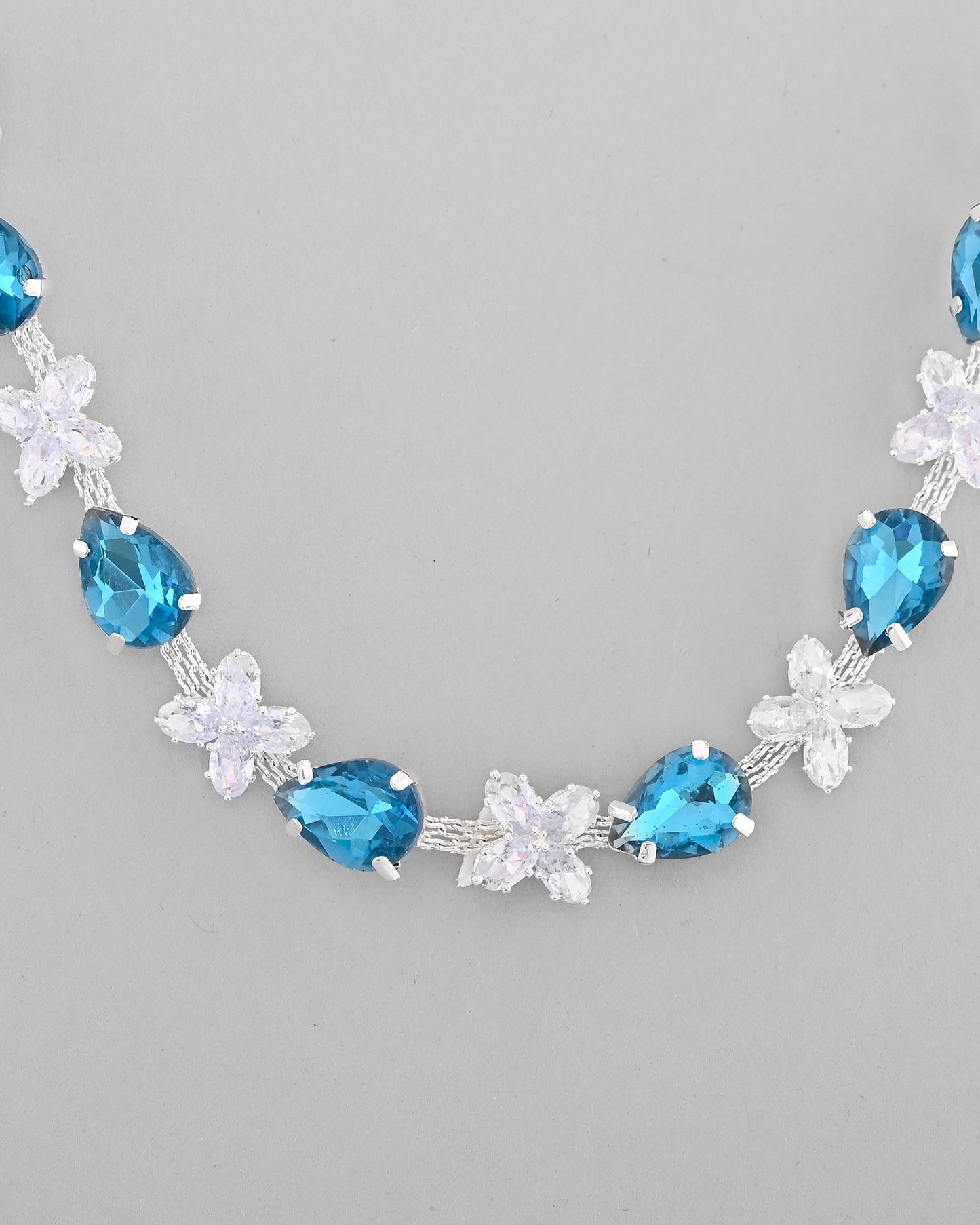 VOJ Silver Plated Blue And White Stone Studded Necklace with Earrings Set