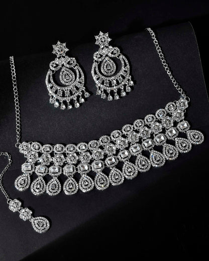 VOJ Silver Plated AD Studded Necklace With Earrings And Mangtikka Set