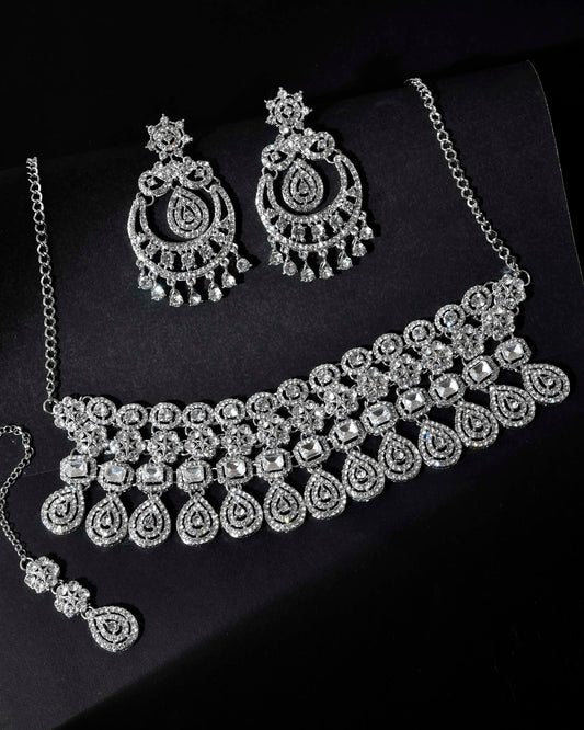 VOJ Silver Plated AD Studded Necklace With Earrings And Mangtikka Set