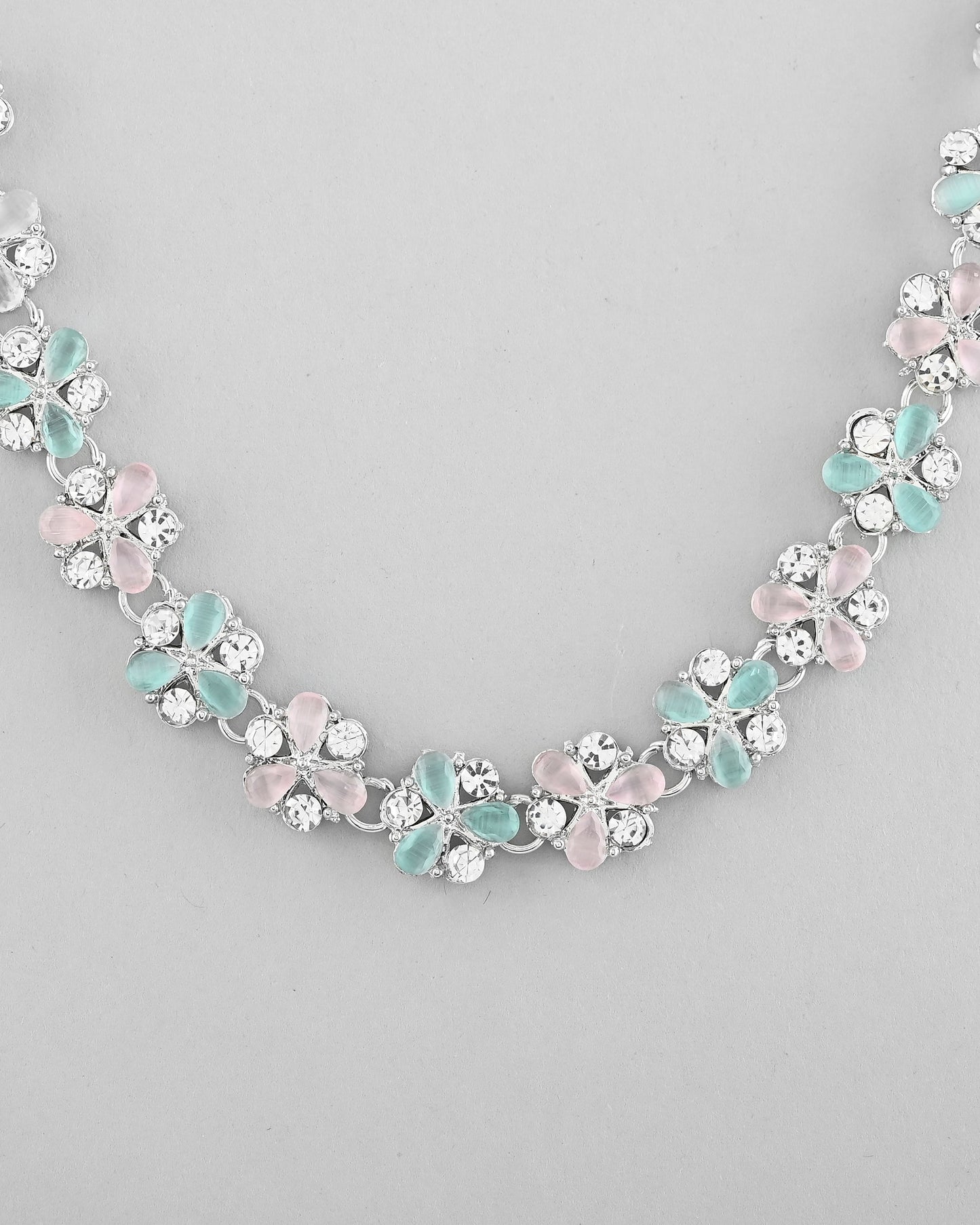 VOJ Silver Plated AD With Nude Green And Light Pink Flower Jewellery Set With Mangtikka