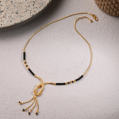 AanyaCentric Gold-Polished Jewelry Combo: Elegant Short Mangalsutra, Finger Ring, and American Diamond Earrings Set