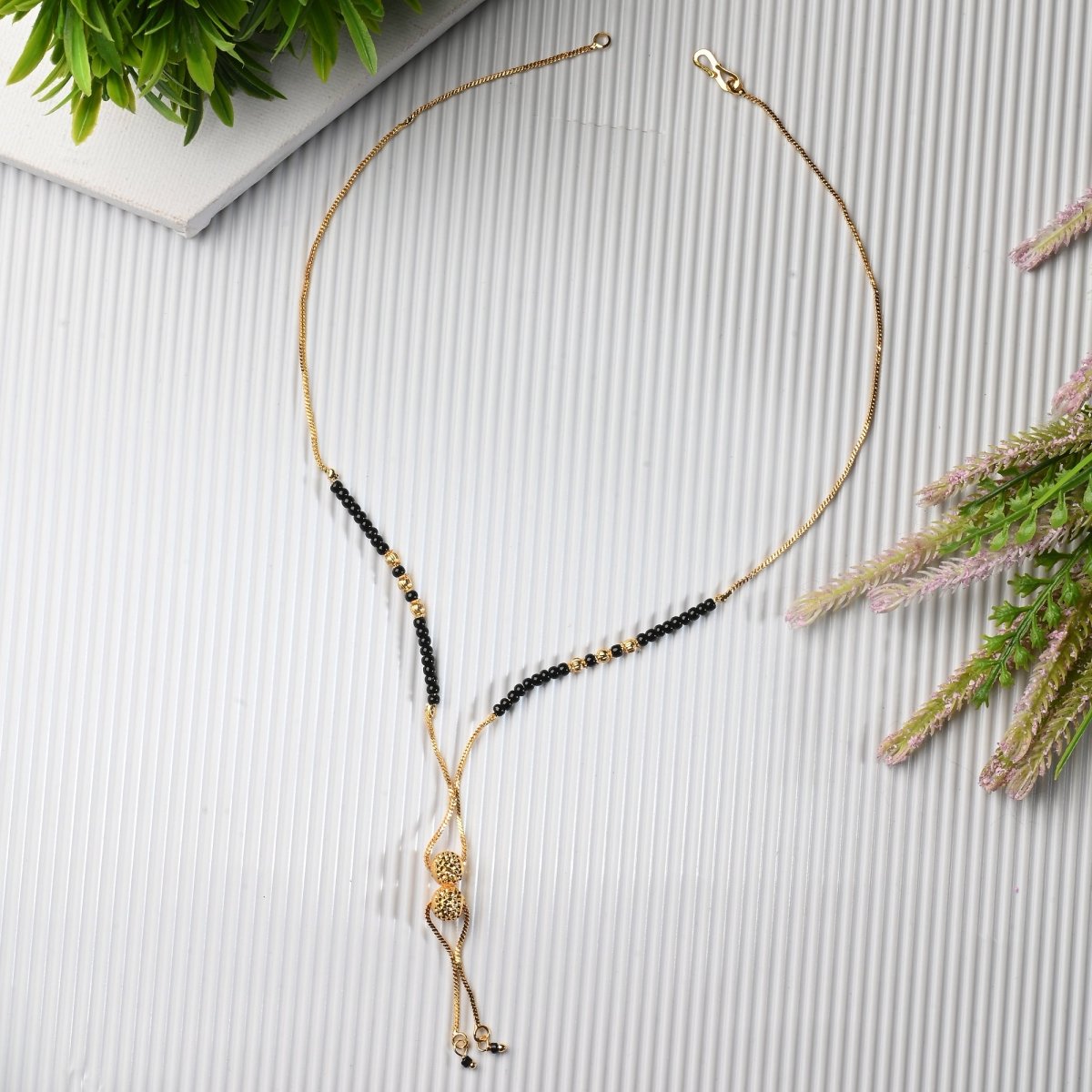 AanyaCentric Gold-Polished Jewelry Combo: Elegant Short Mangalsutra, Finger Ring, and American Diamond Earrings Set