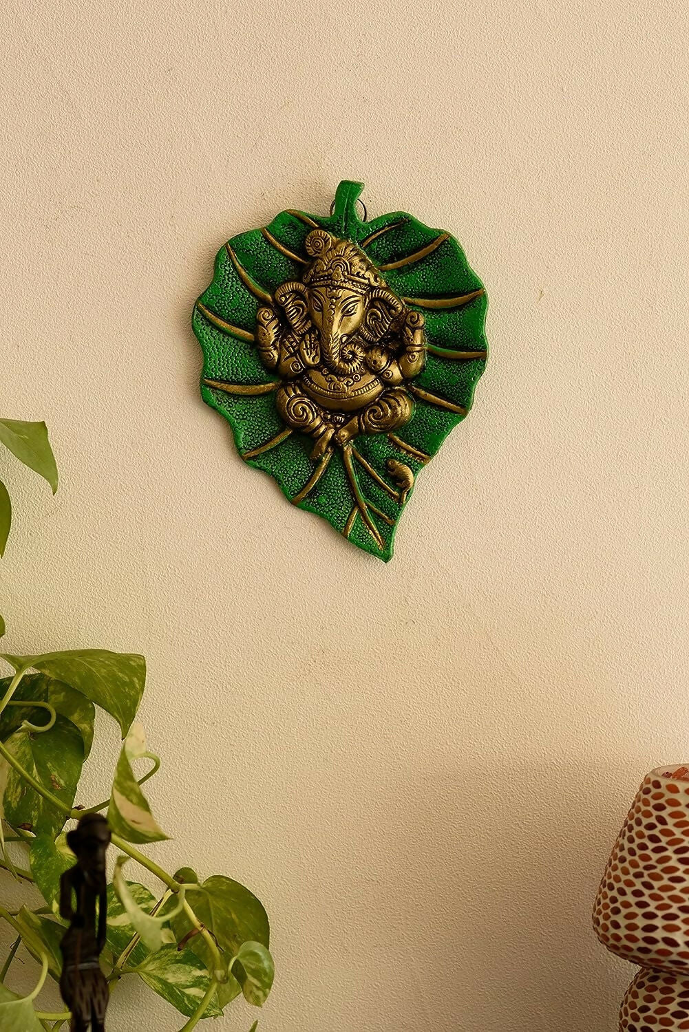 eCraftIndia Metal Golden Lord Ganesha On Green Leaf Wall Hanging Sculpture