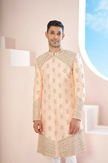 The Peach Sherwani Features Hexagonal Butas , V-Shaped Floral Jal Borders by Hilo Design