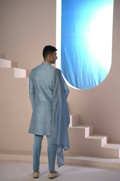 Majestic Blue Sherwani With Intricate Gold Crane And Floral Hand Embroidery. by Hilo Design