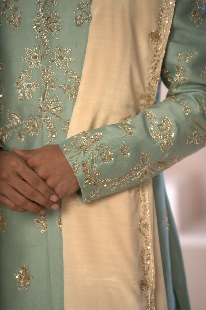 Majestic Mint Green Dupion Silk Sherwani With Satin Dhoti & Santone Dupatta by Hilo Design