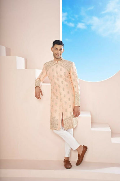 The Peach Sherwani Features Hexagonal Butas , V-Shaped Floral Jal Borders by Hilo Design